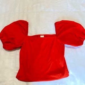Red/orange crop top with puff sleeves